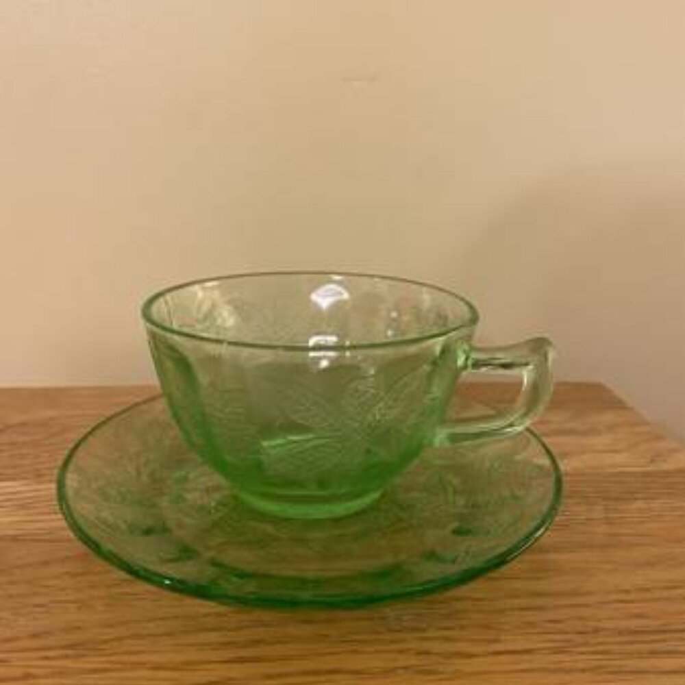 DEPRESSION GLASS GREEN CUP AND SAUCER POINSETTIA PATTERN